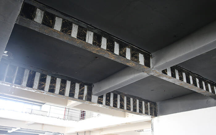 Carbon fiber sheets retrofitting concrete beams Carbon fiber sheets retrofitting concrete beams